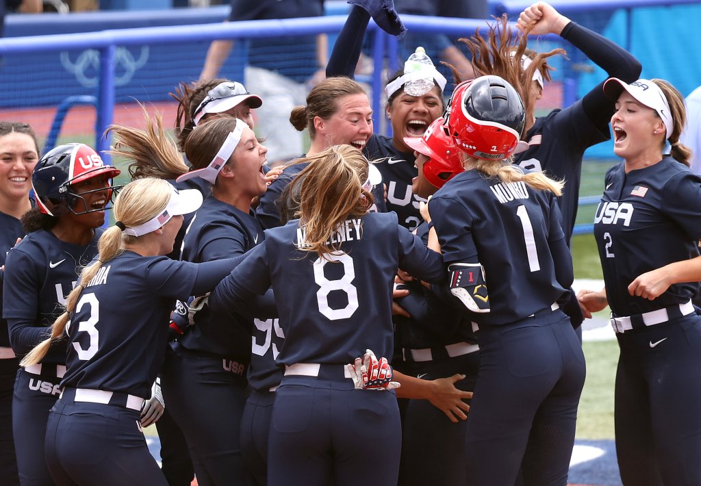 Team United States players celebrate with teammate Kelsey Stewart #7 after she hit a walk-off home run to win the game 2-1 against Team Japan during softball opening round on day three of the Tokyo 2020 Olympic Games at Yokohama Baseball Stadium on July 26, 2021 in Yokohama, Kanagawa, Japan.