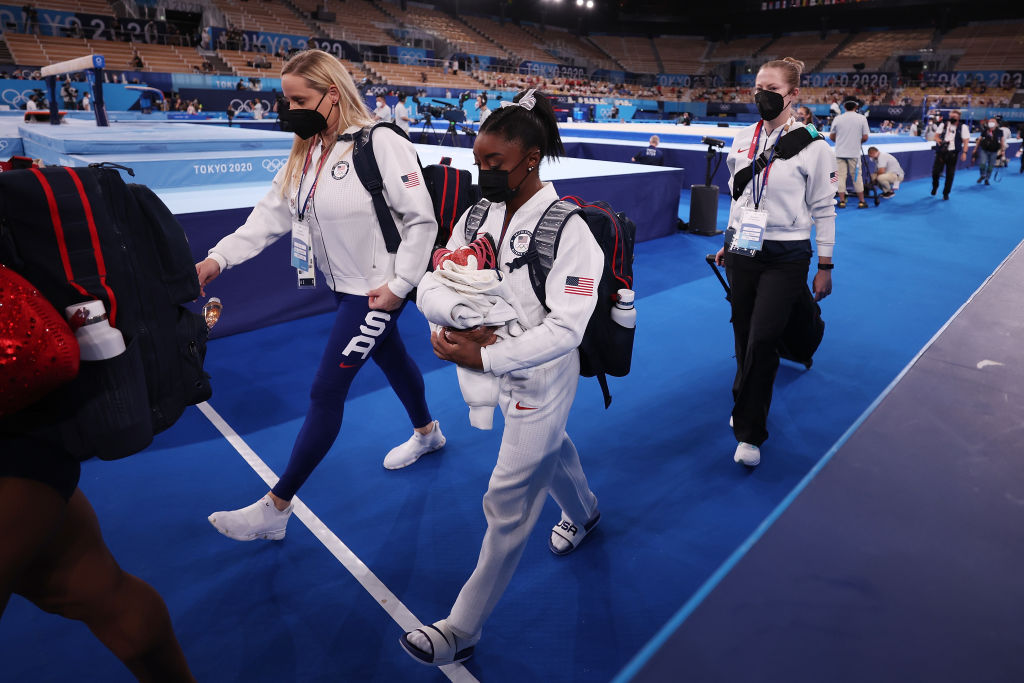 Simone Biles of Team United States walks off the floor during the Women's Team Final on day four of the Tokyo 2020 Olympic Games at Ariake Gymnastics Centre on July 27, 2021 in Tokyo, Japan.