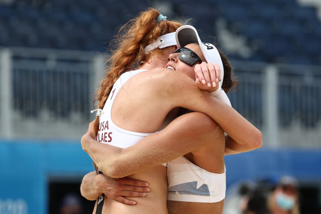 Kelly Claes #1 of Team United States celebrates with Sarah Sponcil #2 after defeating Team Brazil during the Women's Preliminary - Pool D beach volleyball on day eight of the Tokyo 2020 Olympic Games at Shiokaze Park on July 31, 2021, in Tokyo, Japan.