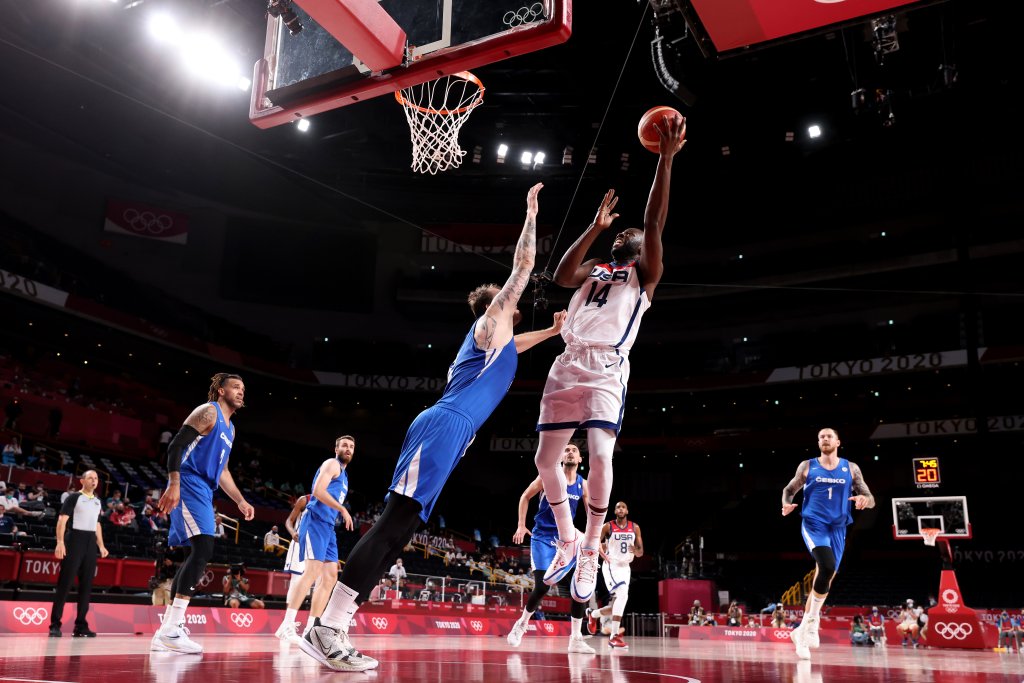 Draymond Green #14 of Team United States drives to the basket against Ondrej Balvin #12 of Team Czech Republic during the first half of a Men's Basketball Preliminary Round Group A game on day eight of the Tokyo 2020 Olympic Games at Saitama Super Arena on July 31, 2021 in Saitama, Japan.