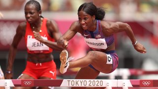 Mulern Jean of Team Haiti and Kendra Harrison of Team United States compete in round one of the Women's 100m hurdles heats on day eight of the Tokyo 2020 Olympic Games