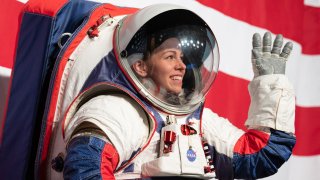 Kristine Davis, a spacesuit engineer at NASA’s Johnson Space Center, wears a ground prototype of the new Exploration Extravehicular Mobility Unit (xEMU), during a demonstration on Oct. 15, 2019.