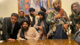 Taliban fighters take control of Afghan presidential palace after the Afghan President Ashraf Ghani fled the country, in Kabul, Afghanistan, Sunday, Aug. 15, 2021.