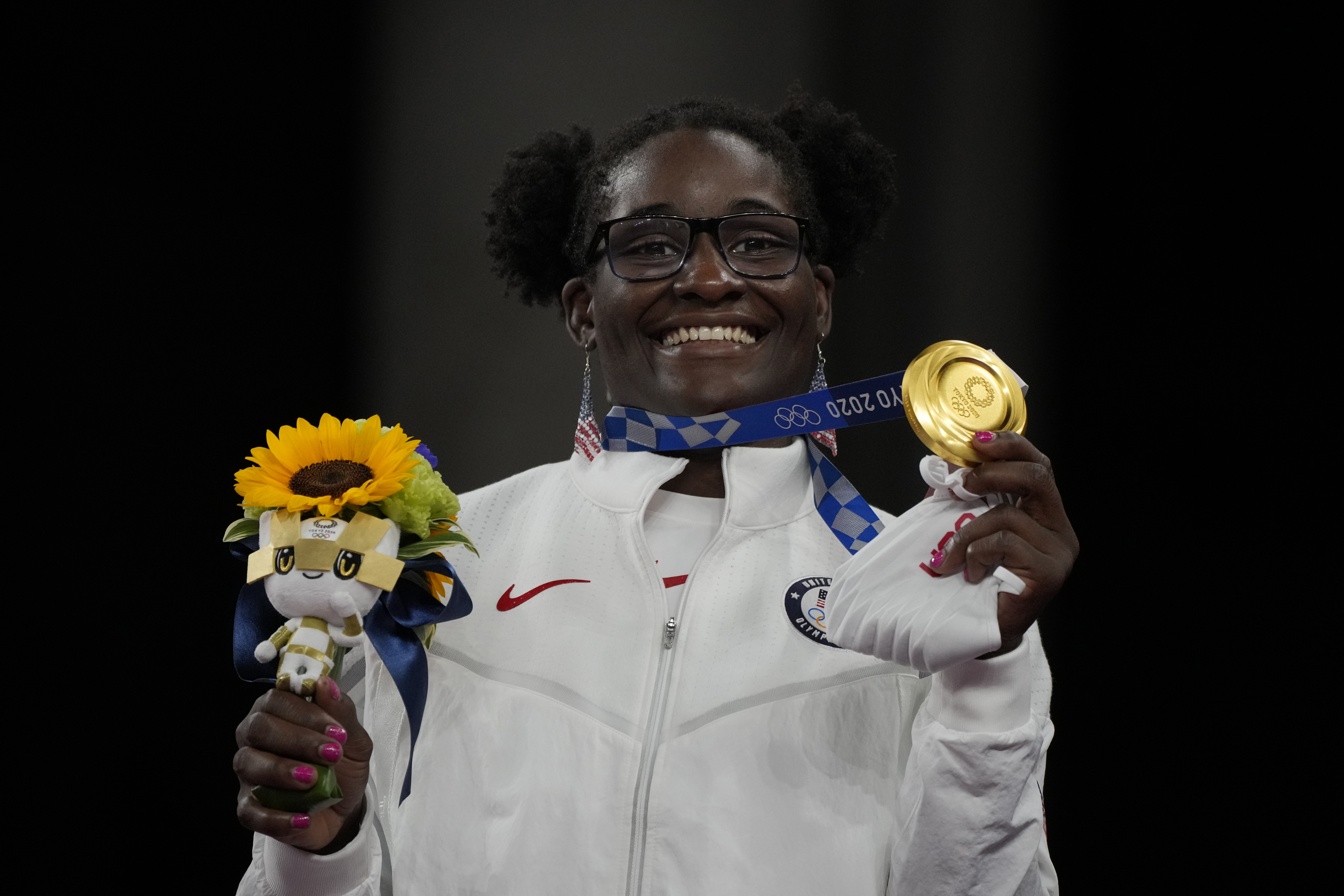 Gold medalist, United States Tamyra Marianna Stock Mensah celebrates on the podium during the medal ceremony for the women's 68kg Freestyle wrestling at the 2020 Summer Olympics, Tuesday, Aug. 3, 2021, in Chiba, Japan.