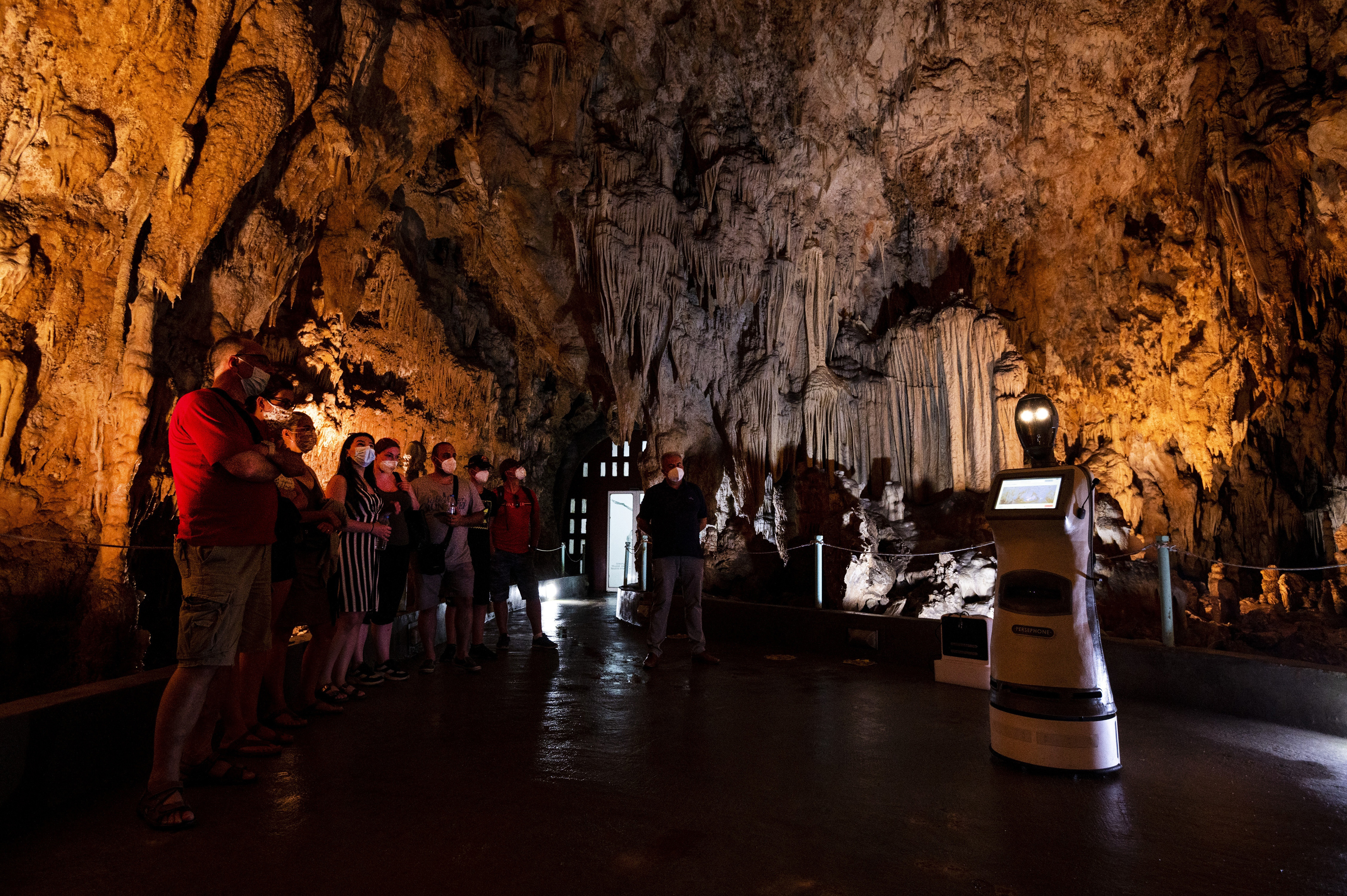 Persephone, the Robot Guide, Leads Visitors in a Greek Cave