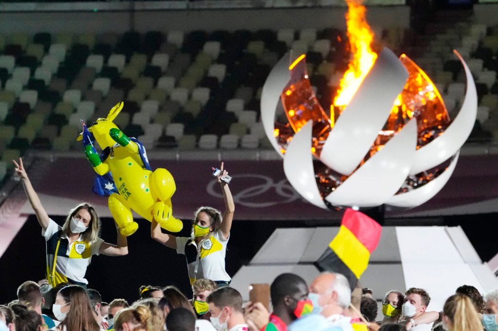 Australia's Sarah Carli, right, celebrates at the closing ceremony in the Olympic Stadium at the 2020 Summer Olympics, Sunday, Aug. 8, 2021, in Tokyo, Japan.