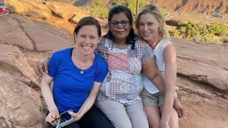 Minnie John, center, poses with actress Julie Bowen, right, and Bowen's sister, Dr. Annie Luetkemeyer