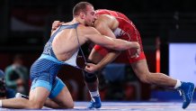 Team USA's David Morris Taylor III, left, and Iran's Hassan Yazdanicharati compete in the men's freestyle 86kg final bout at the 2020 Summer Olympic Games, at the Makuhari Messe convention center.