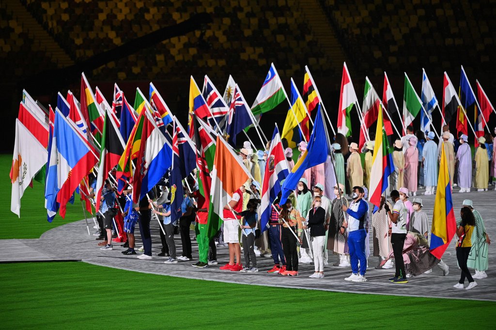 Athletes carry their nations' flags to the field of play during the closing ceremony of the Tokyo 2020 Olympic Games, on Aug. 8, 2021 at the Olympic Stadium in Tokyo.