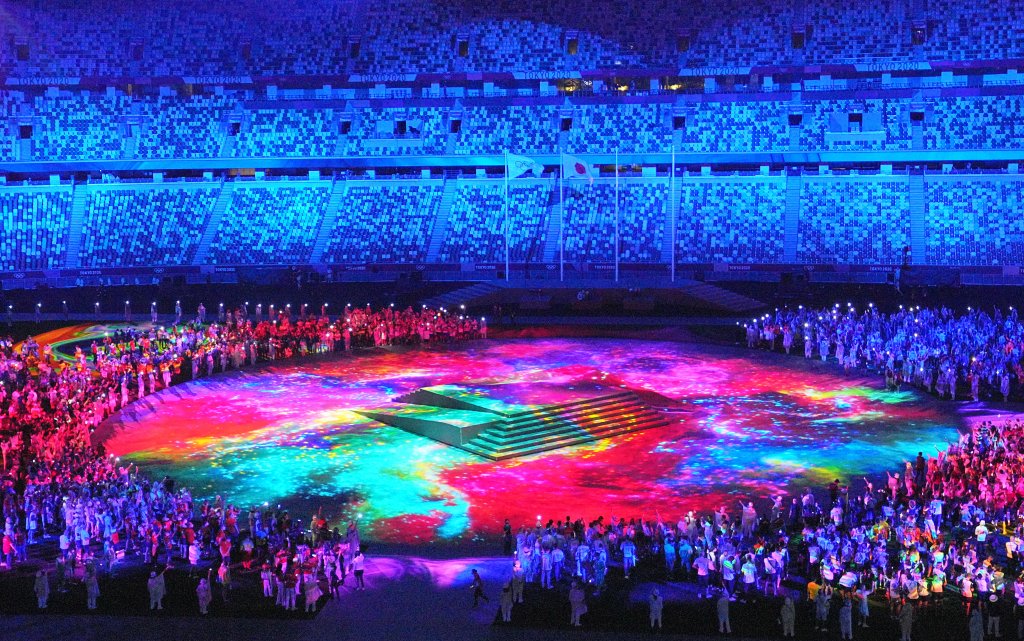 A light show runs in Olympic Stadium as part of the Tokyo Olympics Closing Ceremony, Aug. 8, 2021, Tokyo.