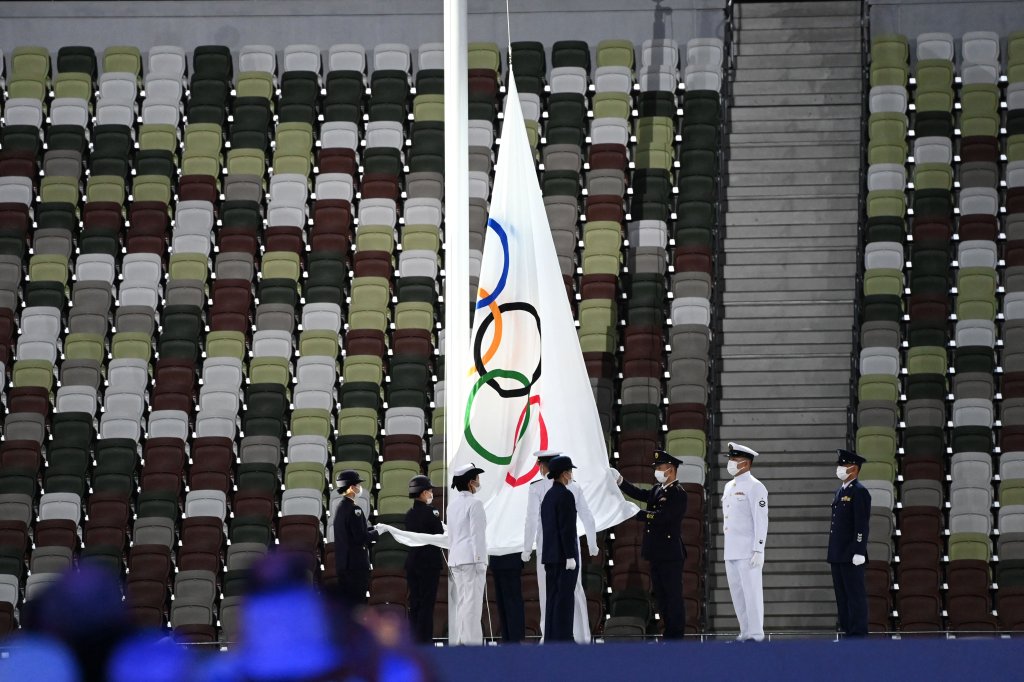 The Olympic flag is taken down during the closing ceremony of the Tokyo 2020 Olympic Games, at the Olympic Stadium, in Tokyo, on Aug. 8, 2021.