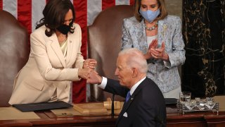 U.S. President Joe Biden fist-bumps Vice President Kamala Harris after he addressed a joint session of Congress with Speaker of the House Nancy Pelosi (D-CA) in the House chamber of the U.S. Capitol April 28, 2021 in Washington, DC.