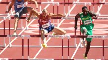 Karel Tilga of Team Estonia, Zachery Ziemek of Team United States and Lindon Victor of Team Grenada compete in the Men's Decathlon 110m Hurdles