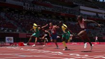 Hansle Parchment of Team Jamaica finishes first ahead of Grant Holloway of Team United States