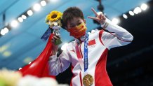 Gold medalist Hongchan Quan of Team China celebrates during the medal ceremony for the Women's 10m Platform Final on day thirteen of the Tokyo 2020 Olympic Games at Tokyo Aquatics Centre on Aug. 5, 2021 in Tokyo, Japan.