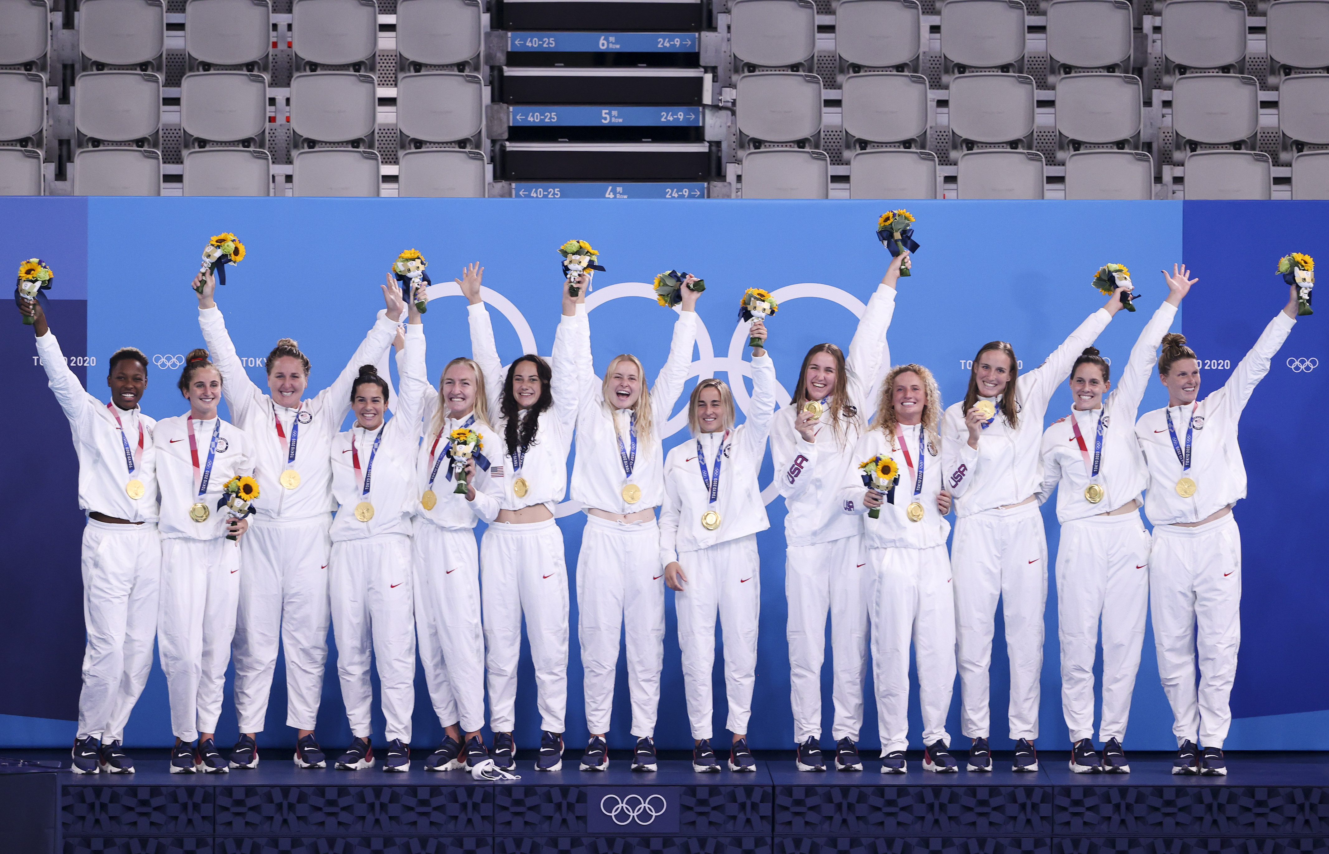 Team USA gold medalists pose on the podium after winning the Women's Gold Medal match between Spain and the United States on day fifteen of the Tokyo 2020 Olympic Games at Tatsumi Water Polo Centre on Aug. 7, 2021 in Tokyo, Japan.