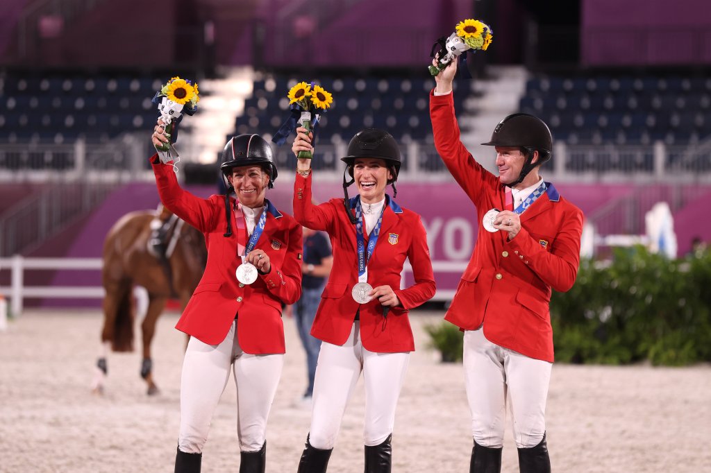 Laura Kraut, Jessica Springsteen and McLain Ward of Team United States pose with their silver medals on the podium during the jumping team final medal ceremony at Equestrian Park on Aug. 7, 2021 in Tokyo, Japan.