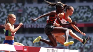 Hyvin Kiyeng of Team Kenya and Lili Anna Toth of Team Hungary compete in round one of the Women's 3000m Steeplechase heats on day nine of the Tokyo 2020 Olympic Games