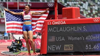USA's Sydney Mclaughlin celebrates after winning the women's 400m hurdles final setting a new world record during the Tokyo 2020 Olympic Games
