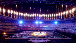 Fireworks erupt above the stadium during the Closing Ceremony of the Tokyo 2020 Olympic Games