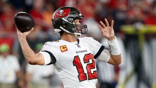 Tampa Bay Buccaneers quarterback Tom Brady (12) throws a pass against the Dallas Cowboys during the first half of an NFL football game Thursday, Sept. 9, 2021, in Tampa, Fla.