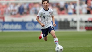 Brenden Aaronson #11 of the United States chases down a loose ball during a game between Costa Rica and USMNT