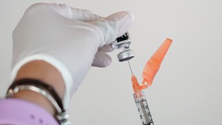 FILE - In this Tuesday, Sept. 21, 2021 file photo, a nurse loads a syringe with the Pfizer COVID-19 vaccine in Jackson, Miss. Millions of Americans are now eligible to receive a Pfizer booster shot to help increase their protection against the worst effects of the coronavirus.