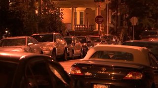 Cars line both sides of a West Philadelphia street