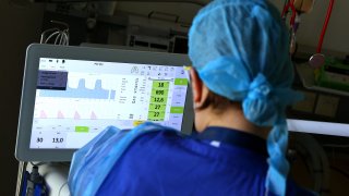 A doctor monitors a Covid-19 patient in the Covid-19 intensive care unit of the community hospital (Klinikum Magdeburg) in Magdeburg, eastern Germany, on April 28, 2021.