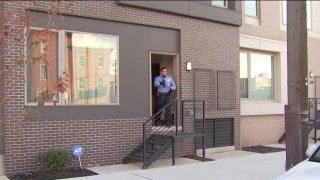 A police officer investigates a scene at a home