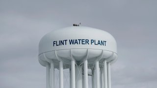 In this Feb. 26, 2016 file photo, the Flint Water Plant tower is shown in Flint, Mich.