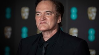 Director Quentin Tarantino poses for photographers upon arrival at the BAFTA awards in London, Sunday, Feb. 2, 2020.