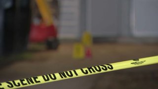 Police tape in front of a home