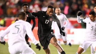 Canada forward Cyle Larin (17) tries to get past Mexico defender Julio Dominguez (3) during the first half of a World Cup Qualifier soccer match at Commonwealth Stadium Edmonton.