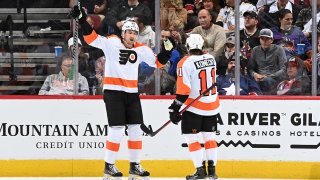 Two hockey players celebrate