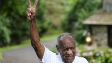 Bill Cosby flashes a victory sign outside his home, June 30, 2021, in Elkins Park, Pennsylvania, after being released from prison. Cosbys sexual assault conviction was tossed after the state's highest court ruled that a former agreement to not bring charges against Cosby on Andrea Constand's behalf was ignored by prosecutors.