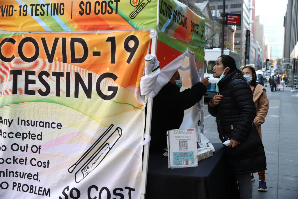 A woman is getting a Covid-19 test at a Covid-19 mobile testing site near the Grand Central in New York City, United States