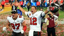 Rob Gronkowski #87 and Tom Brady #12 of the Tampa Bay Buccaneers celebrate after defeating the Kansas City Chiefs in Super Bowl LV at Raymond James Stadium, Feb. 7, 2021 in Tampa, Florida. The Buccaneers defeated the Chiefs 31-9.