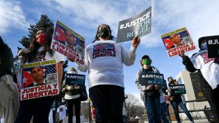 signs during a rally for truck driver Rogel Aguilera-Mederos