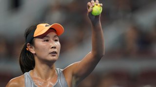 FILE - Peng Shuai of China in action against Daria Kasatkina of Russia during a women's singles first round match on day one of the 2019 China Open tennis tournament, Sept. 28, 2019, in Beijing, China.