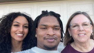 (Left) Jamal Hinton and his family member and Wanda Dench.