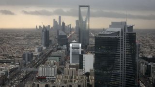 The Kingdom Tower, operated by Kingdom Holding Co., centre, stands on the skyline above the King Fahd highway in Riyadh, Saudi Arabia.