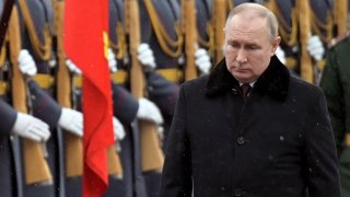 Russian President Vladimir Putin attends a wreath-laying ceremony at the Tomb of the Unknown Soldier, near the Kremlin Wall during the national celebrations of the ‘Defender of the Fatherland Day’ in Moscow, Russia, Wednesday, Feb. 23, 2022.