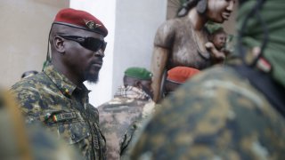 FILE – Guinea’s Junta President Col. Mamady Doumbouya, leaves a meeting with an ECOWAS delegation in Conakry, Guinea, Sept. 10, 2021.