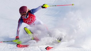Mikaela Shiffrin, of the United States skis out in the first run of the women's slalom at the 2022 Winter Olympics, Wednesday, Feb. 9, 2022, in the Yanqing district of Beijing.