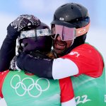 Lindsey Jacobellis of Team United States (L) and Nick Baumgartner of Team United States (R) celebrate winning the gold medal during the Snowboard Mixed Team Cross Big Final on day 8 of the 2022 Winter Olympics at Genting Snow Park on Feb. 12, 2022, in Zhangjiakou, China.