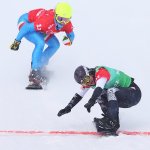 Lindsey Jacobellis of Team United States (R) and Michela Moioli of Team Italy (L) cross the finish line during the Snowboard Mixed Team Cross Big Final on day 8 of the 2022 Winter Olympics at Genting Snow Park on Feb. 12, 2022, in Zhangjiakou, China.