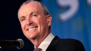 Gov. Phil Murphy smiles