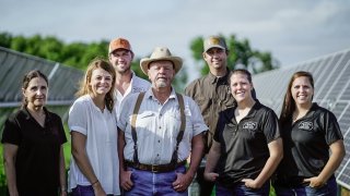 The White Oak Pastures Board of Directors: Front Row, Left to Right: Jean Turn, Jodi Benoit, Will Harris, Jenni Harris, Amber Harris. Back Row, Left to Right: John Benoit, Brian Sapp.