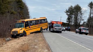This photo provided by the Topsham Police Department shows a school bus that students steered to safety after the 77-year-old male driver suffered a medical event that left him incapacitated, March 14, 2022, in Topsham, Maine.